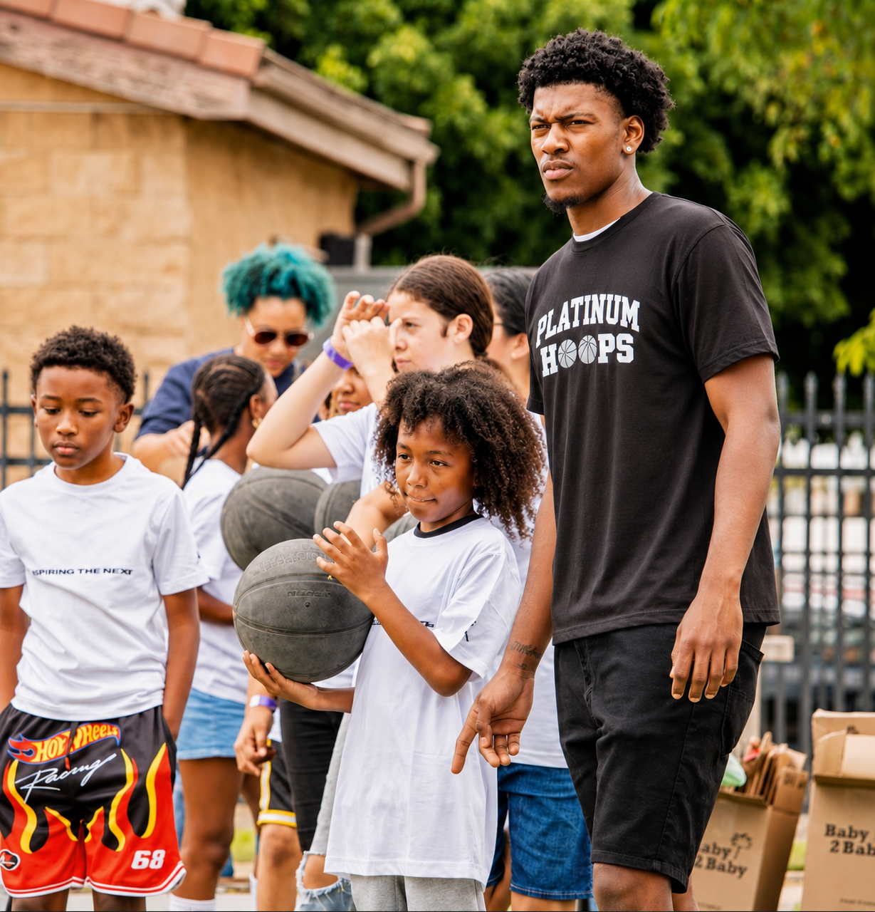 Coach teaching young basketball players on the court
